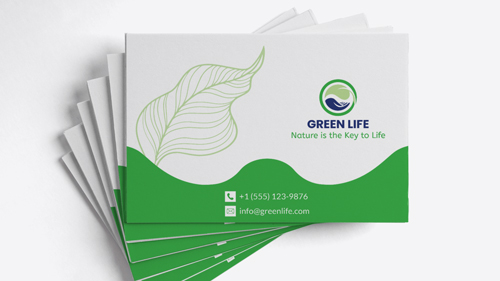 Green and white envelope printing paper material promoting a sustainable future and reading Green Life