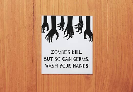 zombie-themed Halloween door sign in white