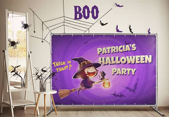 cute Halloween party backdrop in purple displayed indoors