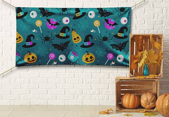 Halloween backdrop idea in greenish colors with a holiday-themed pattern