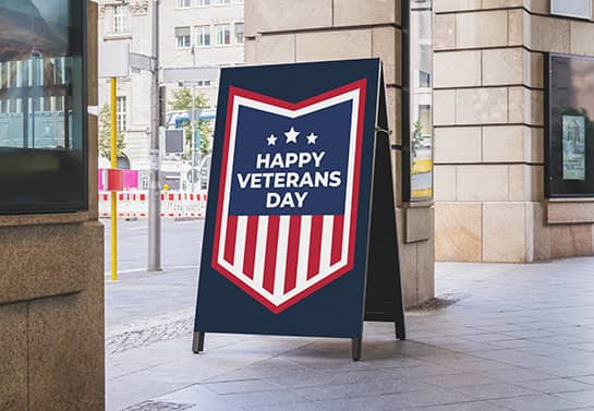 free-standing Happy Veterans Day sign displayed at the entrance