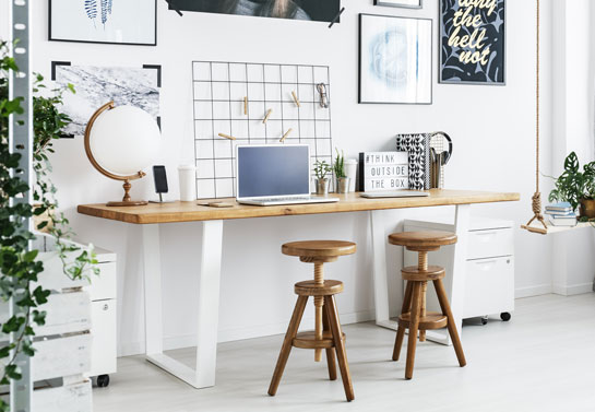 white home office minimalistic look with wooden decor and plants