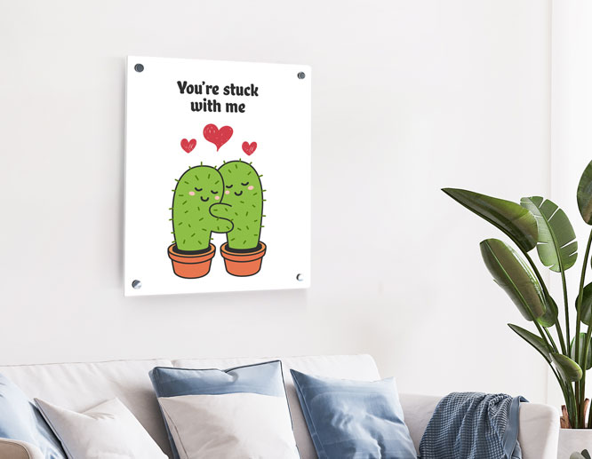 Valentine decoration idea with a funny wall plaque picturing cute hugging cacti and a quote