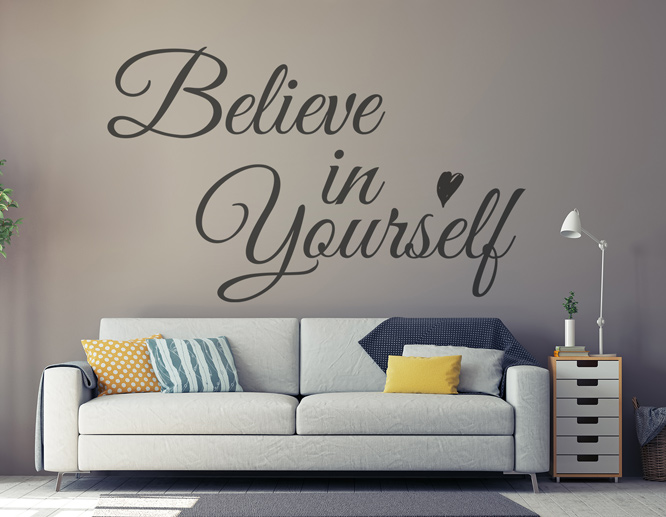 Motivational living room wall decal above a sofa