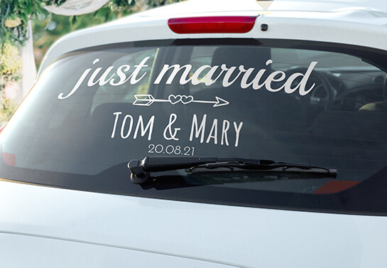 just married sign idea displayed on a car rear window