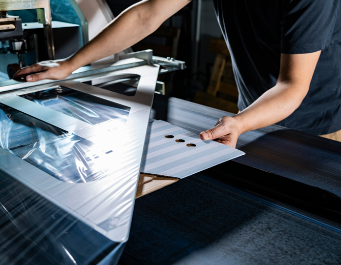 Professional printer operating digital printing press with high-quality color output.