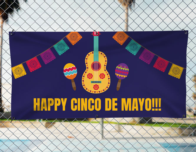 Large Cinco de Mayo printable banner set up on the fence for a festival