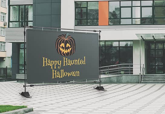 large Halloween party banner in black at the front of an office