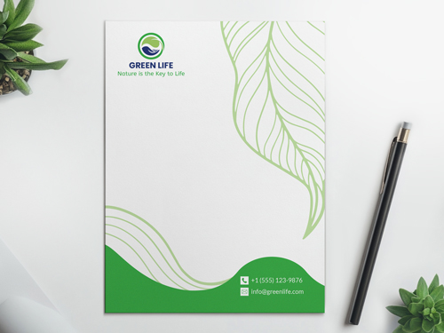 Letterhead printing with an eco-friendly design featuring green leaf accents and clean layout