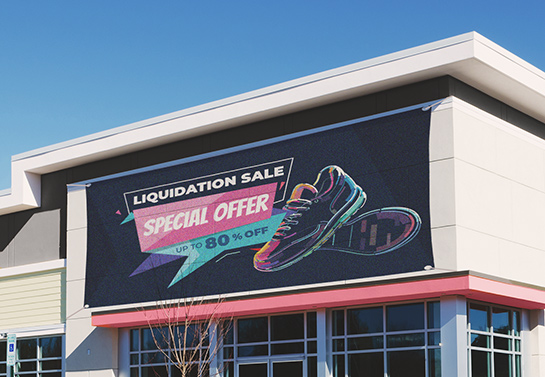 Liquidation sale sign displaying sneakers and up to 80% sale hanged above the store