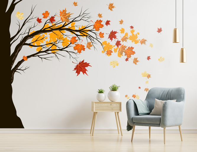 Living room vinyl wall art decal portraying a tree with falling leaves