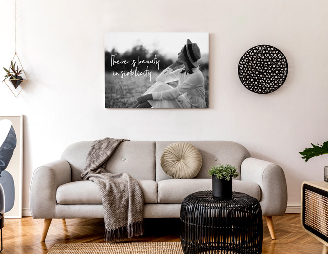 black and white contemporary wall art with a female's photograph and a simplicity quote