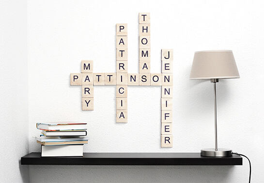 Mother's day wooden wall art project with family names' scrabble