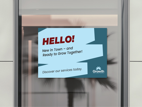 A blue window cling with a dark blue and red text advertising a new business opening in the area.