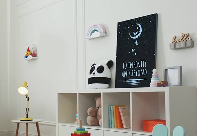 Kids bedroom wall art with a print of the night sky and a quote