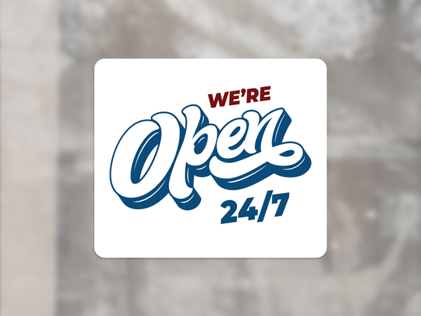 A white window cling with blue and red text and figures showcasing a shop's opening time.