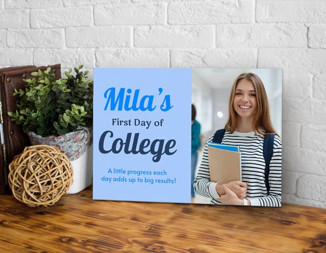 Personalized back to school sign with a FIRST DAY OF COLLEGE note placed on a desk