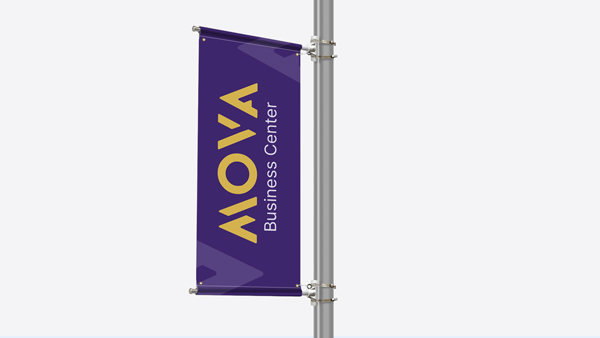 Vertical pole banner reading MOVA Business Center on a purple background with gold text.
