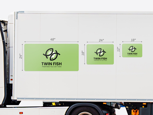 Vehicle magnets shown attached to the side of a trailer to comare the different sizes of the product.