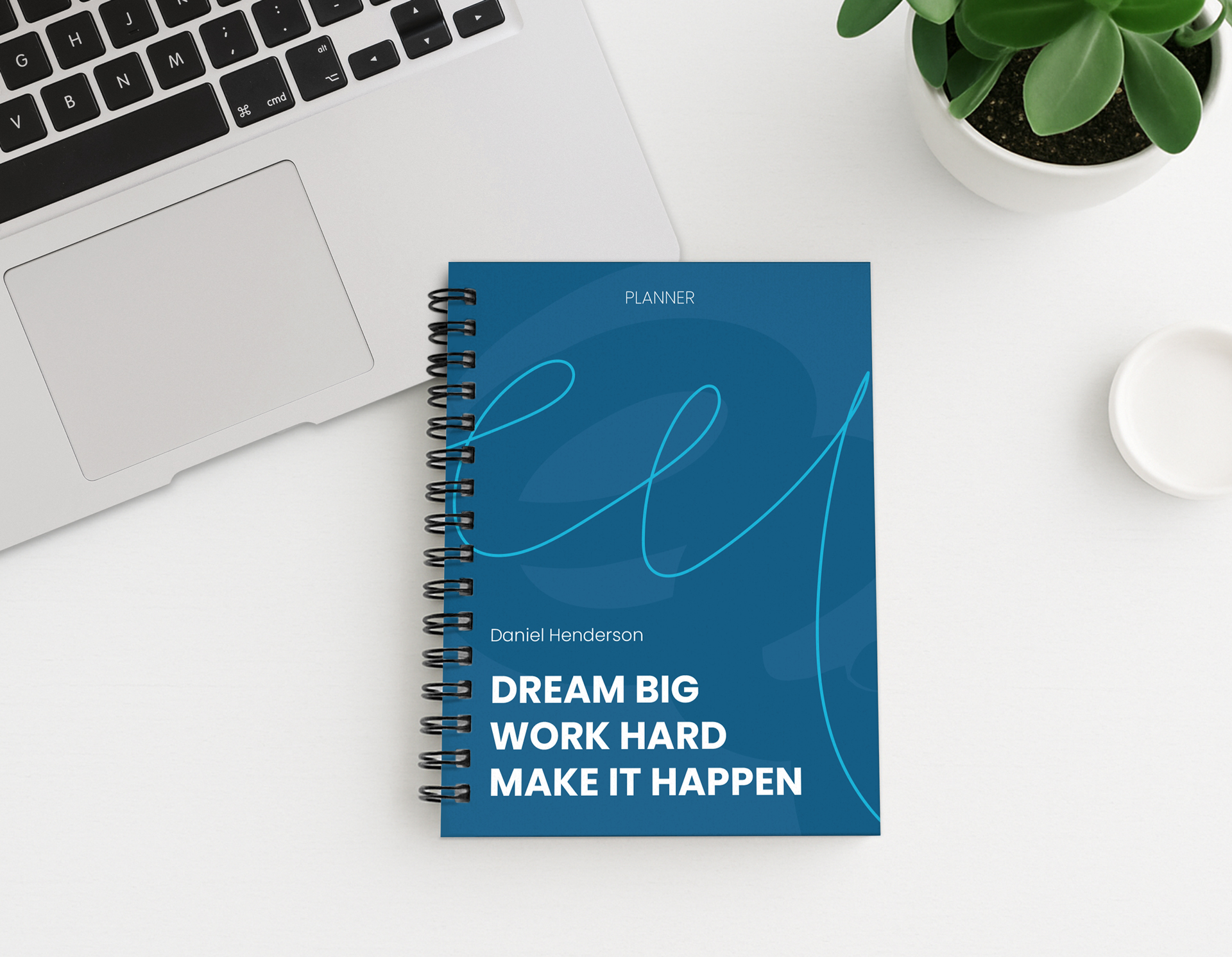Sleek and minimalist typography on a blue planner with an inspirational thought.