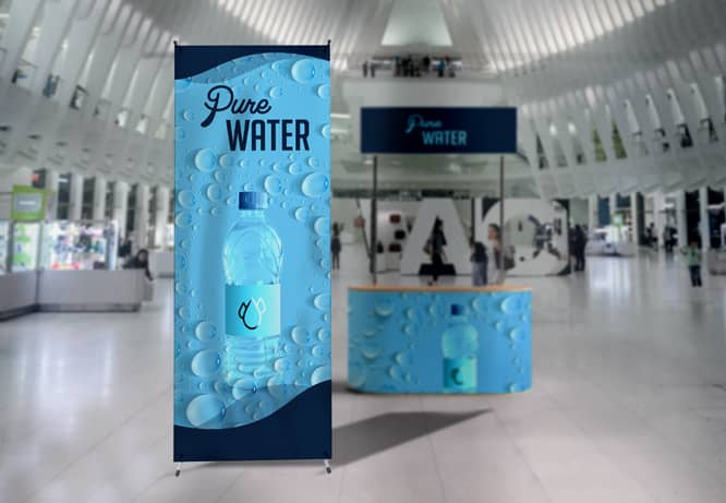 Promotional graphics displayed next to the trade show stand portraying water bottle