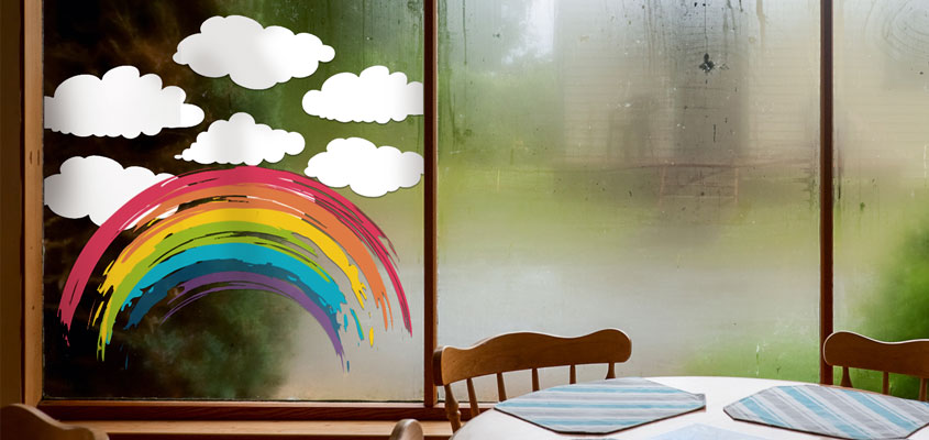 kid's room window decorating idea with cute rainbow and cloud decals