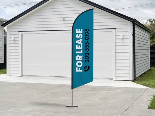 Real estate sign in blue displaying a property available for lease