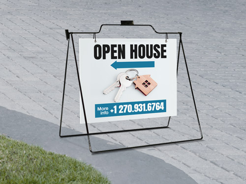 Directional real estate sign guiding visitors to a property's open house