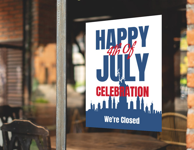 White fourth of July closed sign with blue and red illustrations adhered to the window