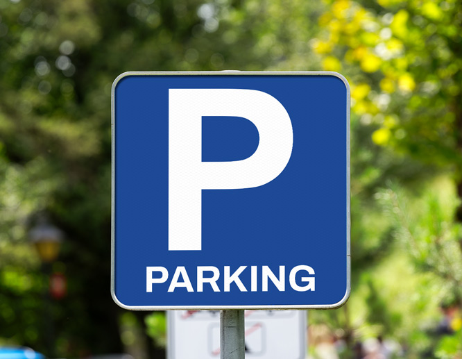 A blue reflective aluminum sign displays the capital 'P' and reads 'Parking' down below.