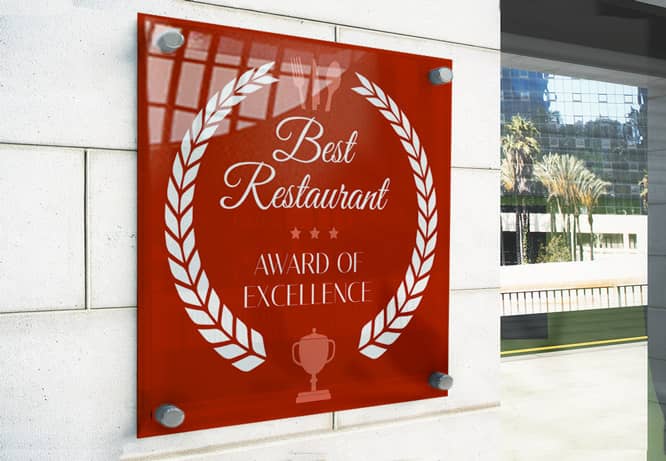 Culinary award certificate in red and white colors hung on the restaurant entrance wall