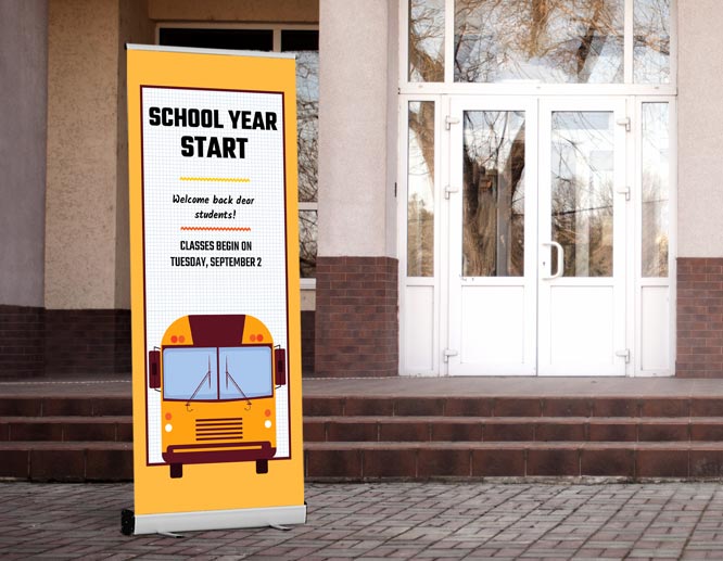 Retractable welcome back to school banner reading School Year Start and installed at the entrance