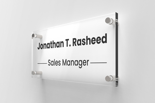 Sales manager acrylic nameplate reading Jonathan T. Rasheed in black on a white background