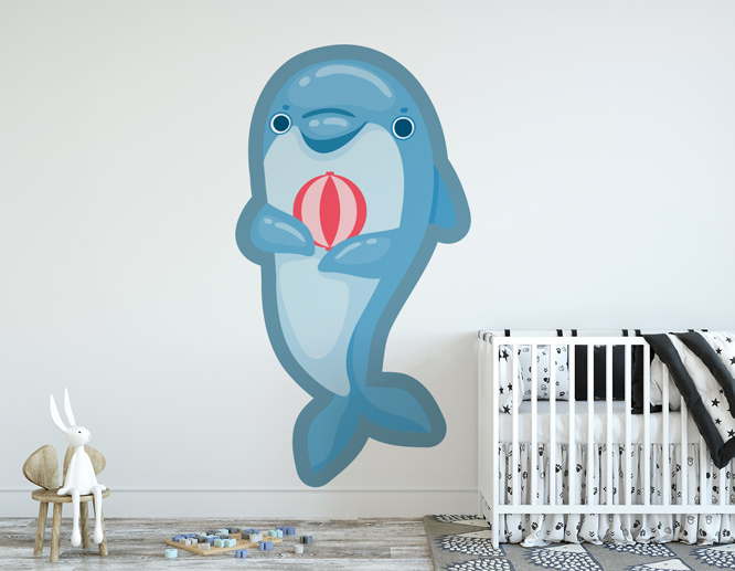 Custom-cut nursery decal displaying a smiling dolphin holding a ball