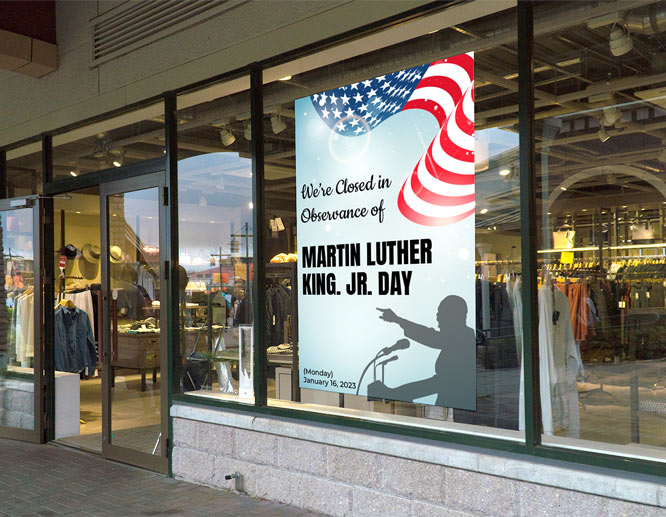 Rectangular Martin Luther King Day closed sign with the US flag on the store window
