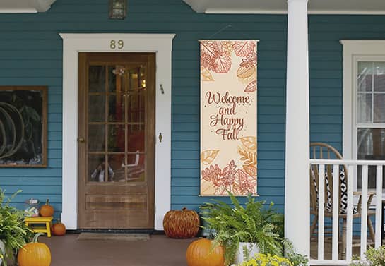 welcoming Thanksgiving porch sign hanging at the door