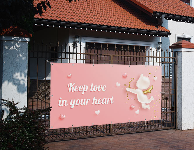 Angel-themed Valentine's Day decoration idea displaying a love quote hung on a fence