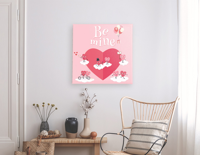 Pink-hued Valentine decoration idea reading a Be Mine note and displayed on the wall