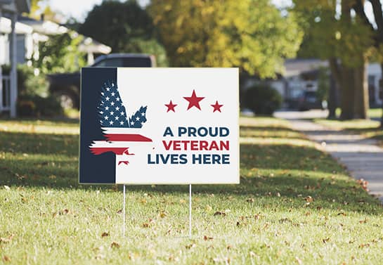 Veterans Day yard sign with a Veteran Lives Here display