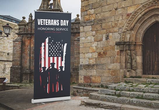Veterans Day church event sign in a dark color displayed at the entrance