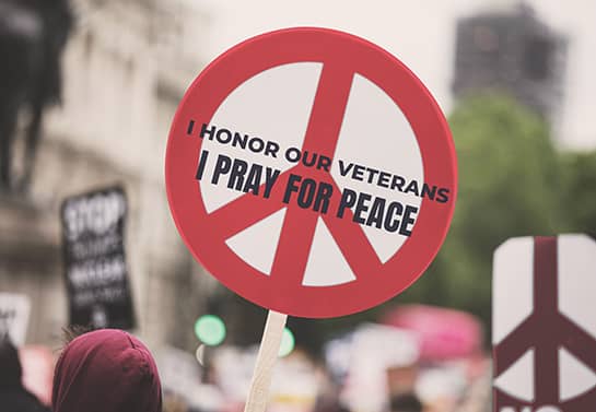 Veterans Day peace sign in a round shape in red color