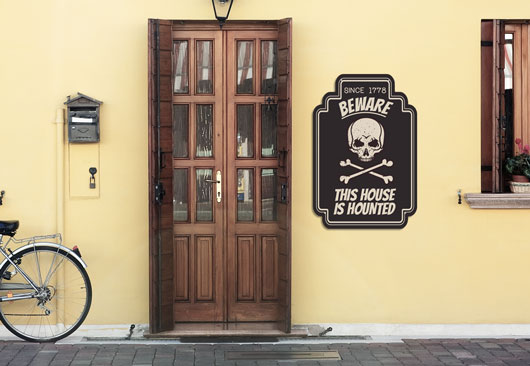 vintage Halloween sign in black displaying a beware notice