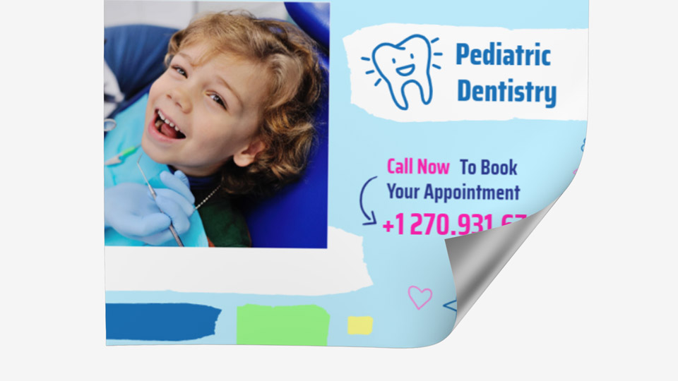 Wall decal featuring a smiling child and contact information promoting a pediatric dentistry