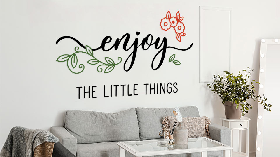 Vinyl wall lettering for interior branding featuring the text 'Enjoy the little things'