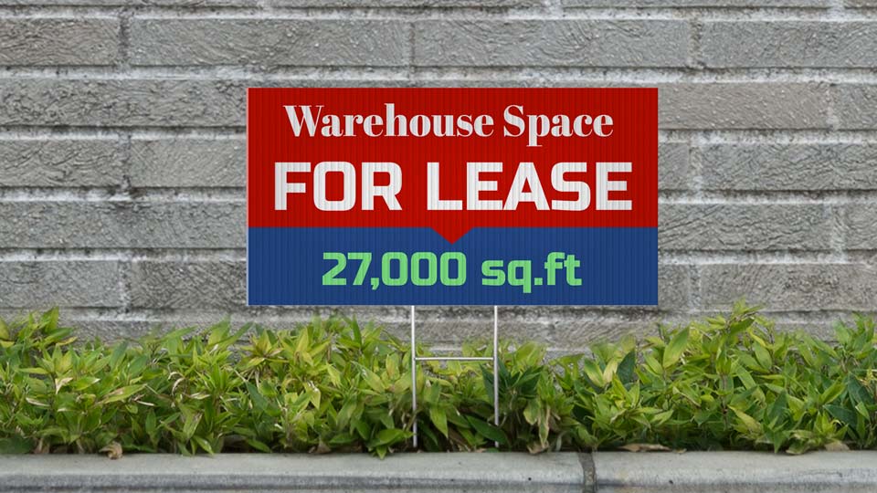 Warehouse For Lease sign in red and blue