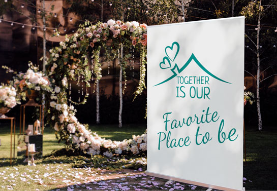 love quote on outdoor wedding backdrop banner
