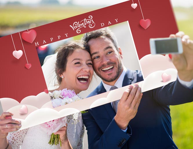 Valentine decoration idea showcasing newlyweds snapping a selfie with a red selfie board