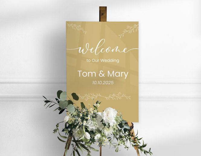 Golden acrylic sign for welcoming wedding guests and featuring the bride and groom's names and wedding date