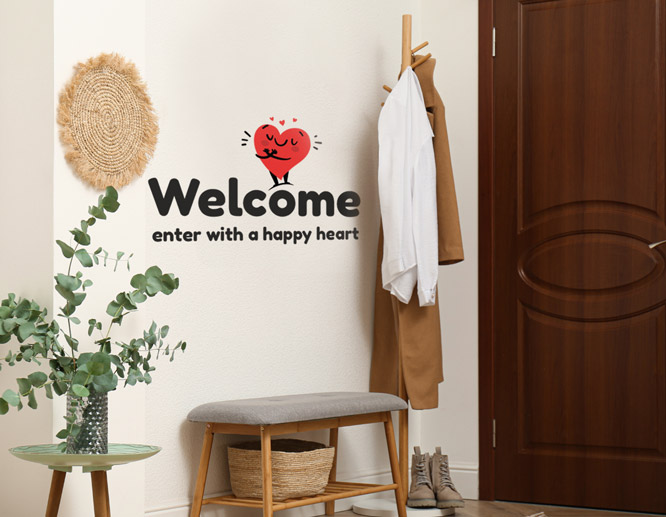 Welcoming positive wall art with a heart illustration around the entryway