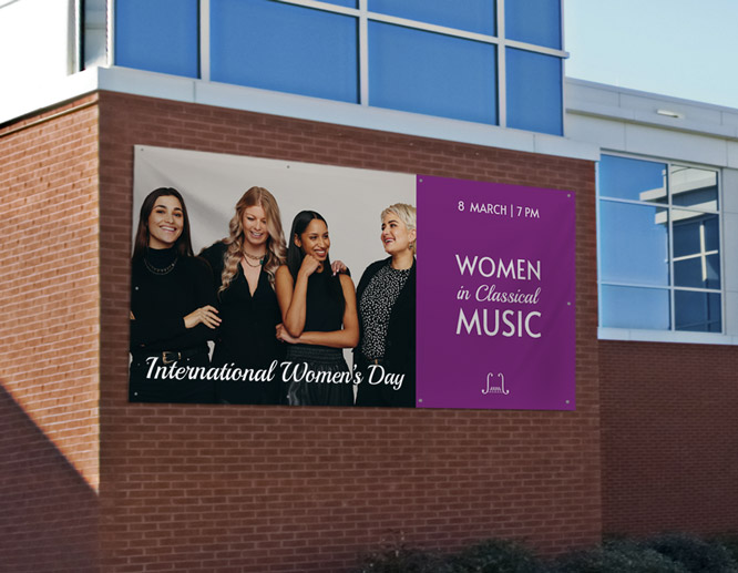 Large International Women’s Day poster showcasing the event name and date on the building